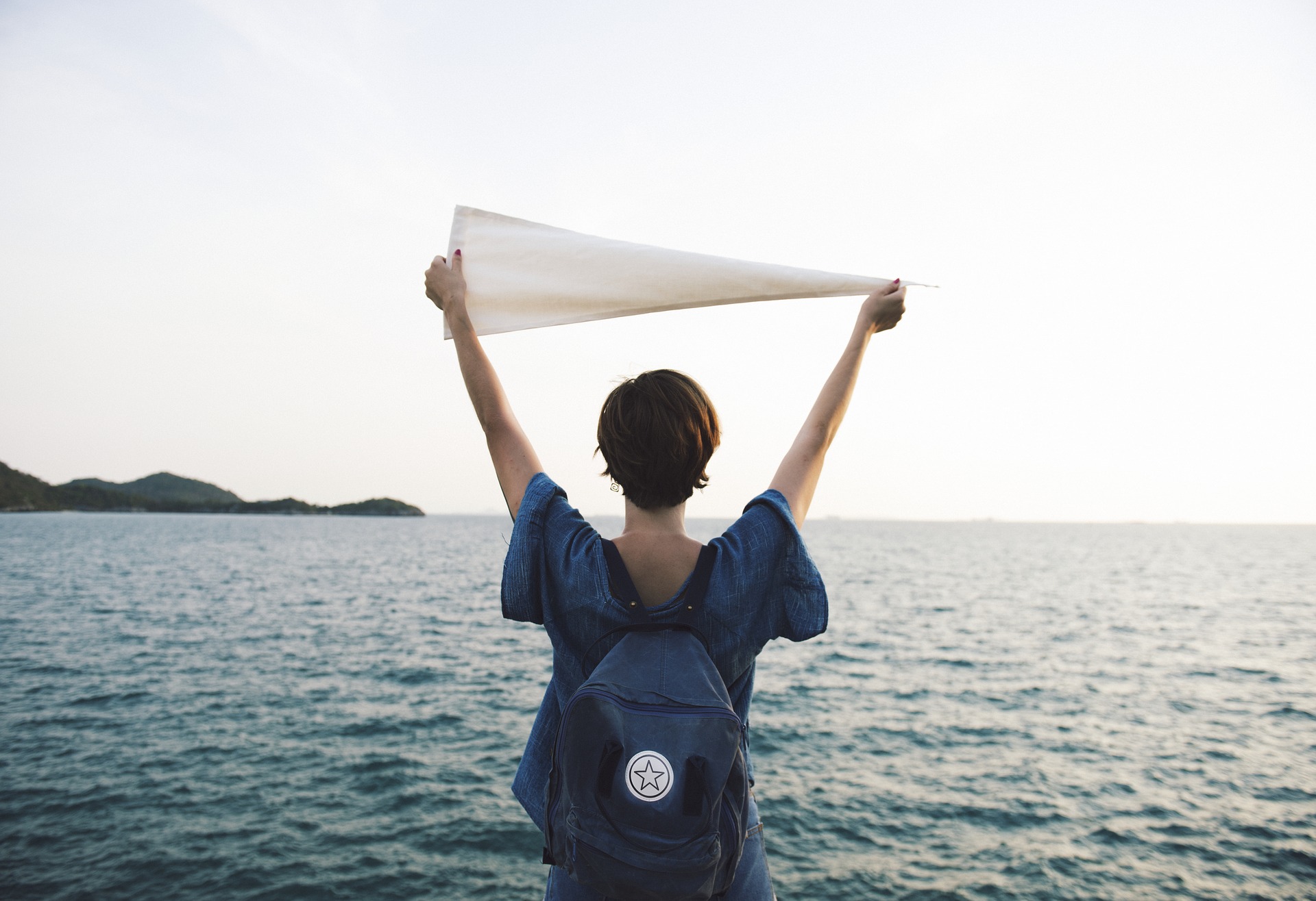 woman holding flag in air